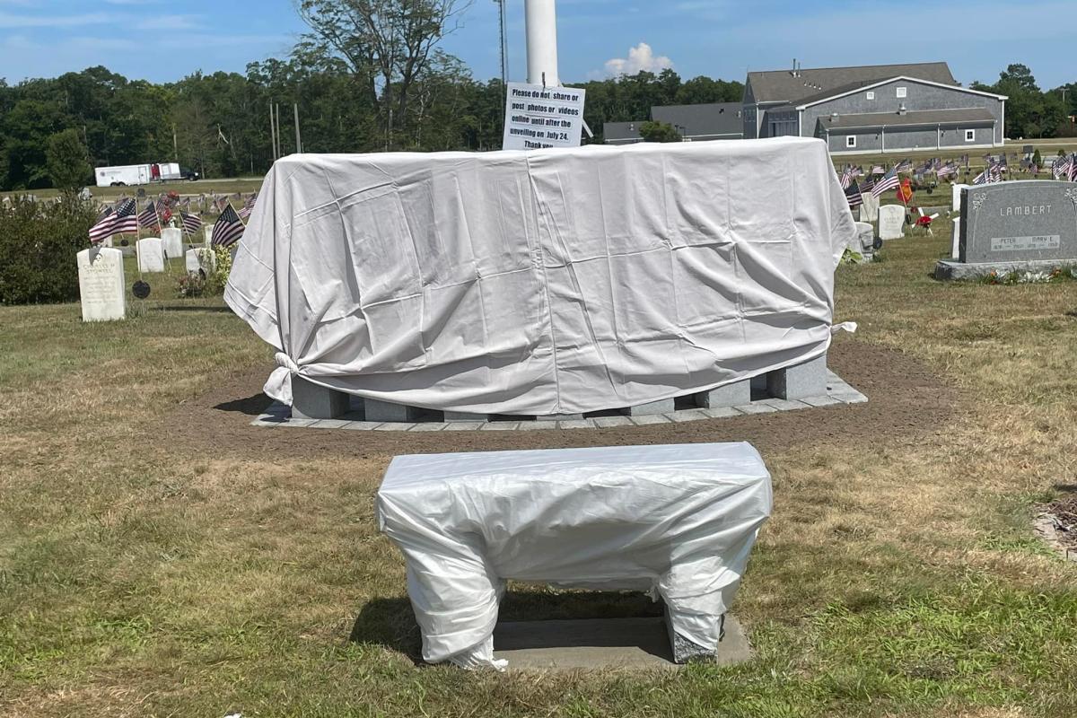 Front view of completed monument, covered up and ready for installation