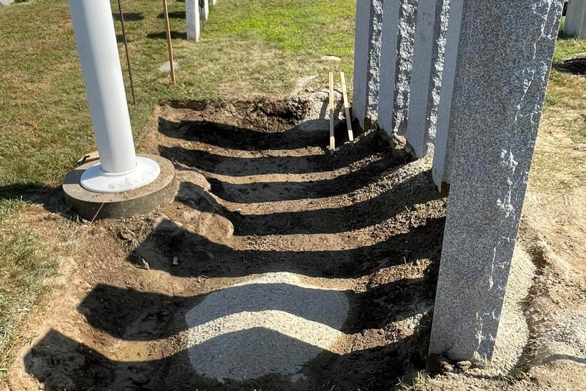 Pillar installation complete, ground prepared for bluestone paver installation