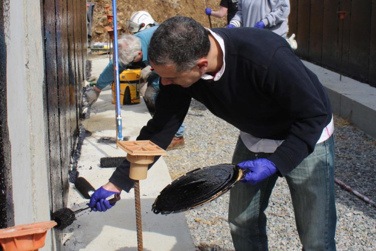 Westport Affordable Housing Trust's Housing Specialist Leonardi Aray was among the volunteers helping out at the Buzzards Bay Habitat for Humanity home site in Westport. 